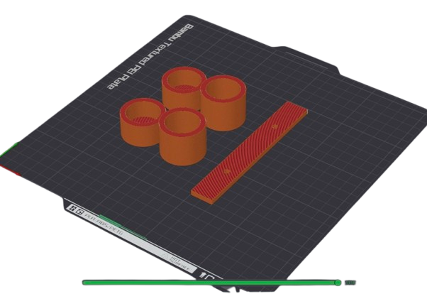 3D-printed ORCAS filter casings and support bar post-printing on textured PEI build plate.